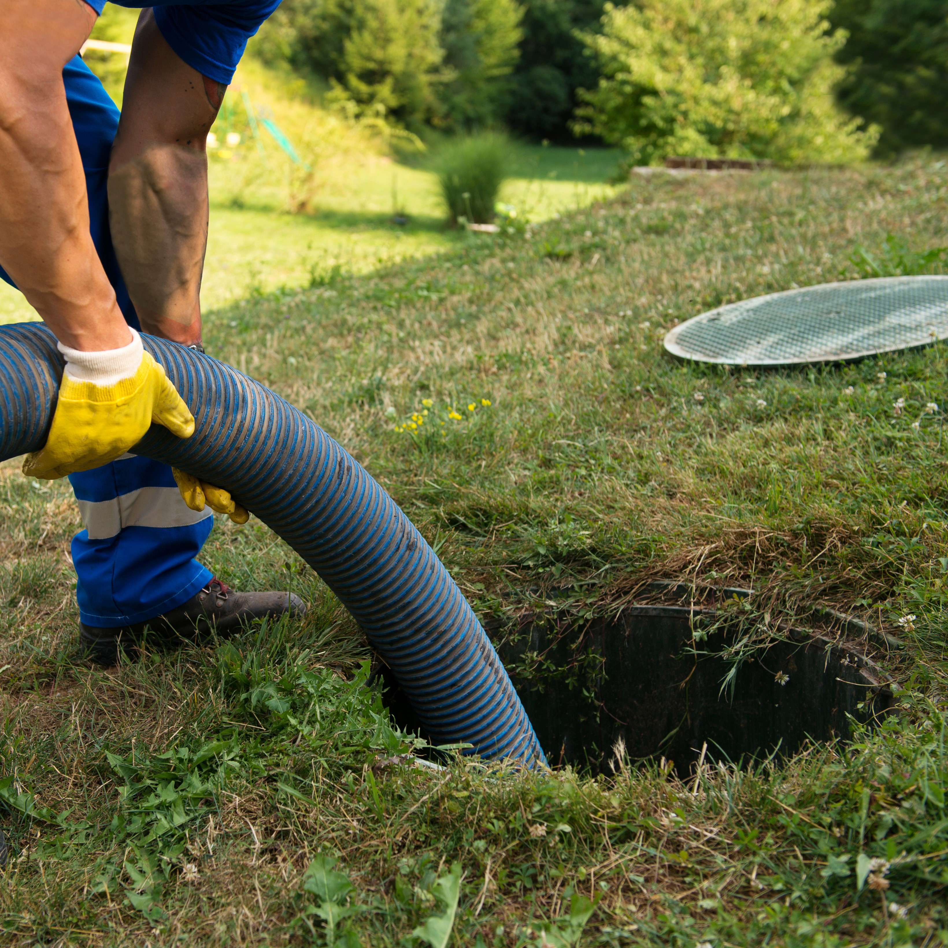 Emptying household septic tank. Cleaning sludge from septic system.