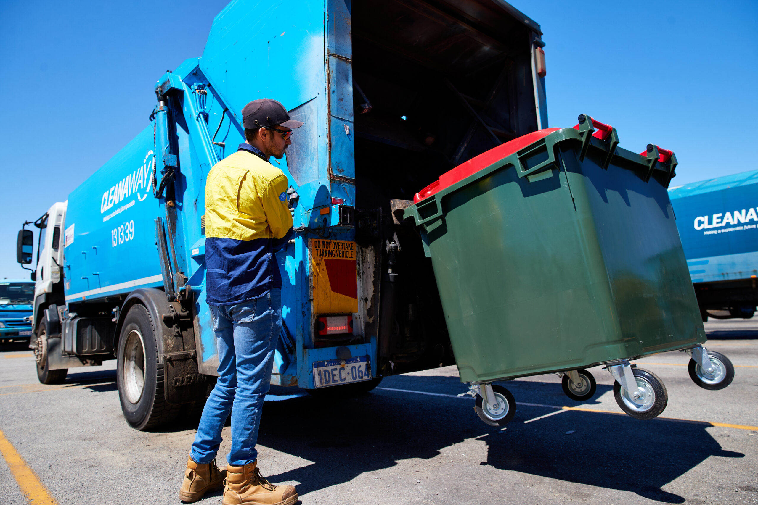 Driver, rear lift truck, bin