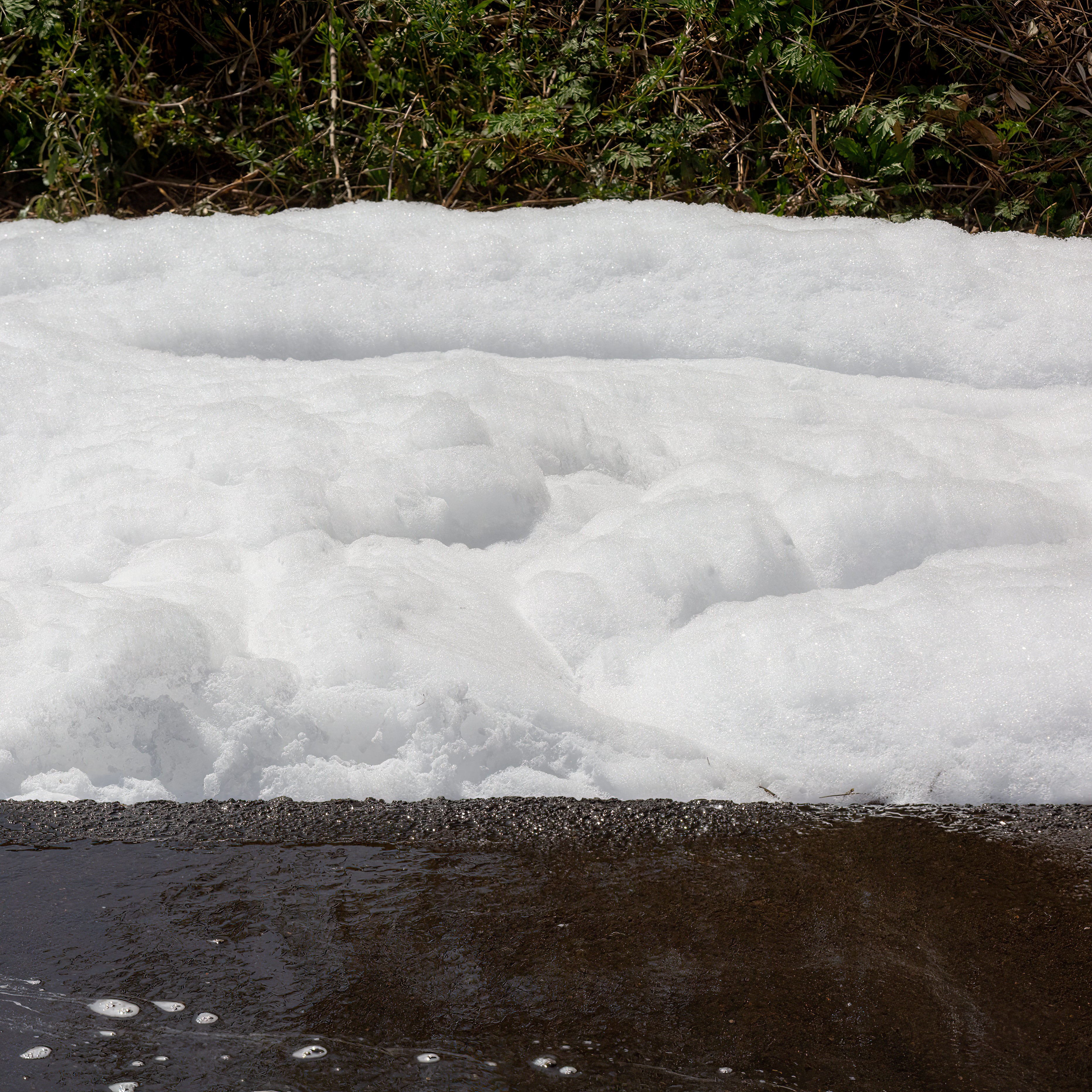 Environmental Hazard: Toxic PFOS Chemical Fire Foam Floating Down Street, Firefighting Chemicals