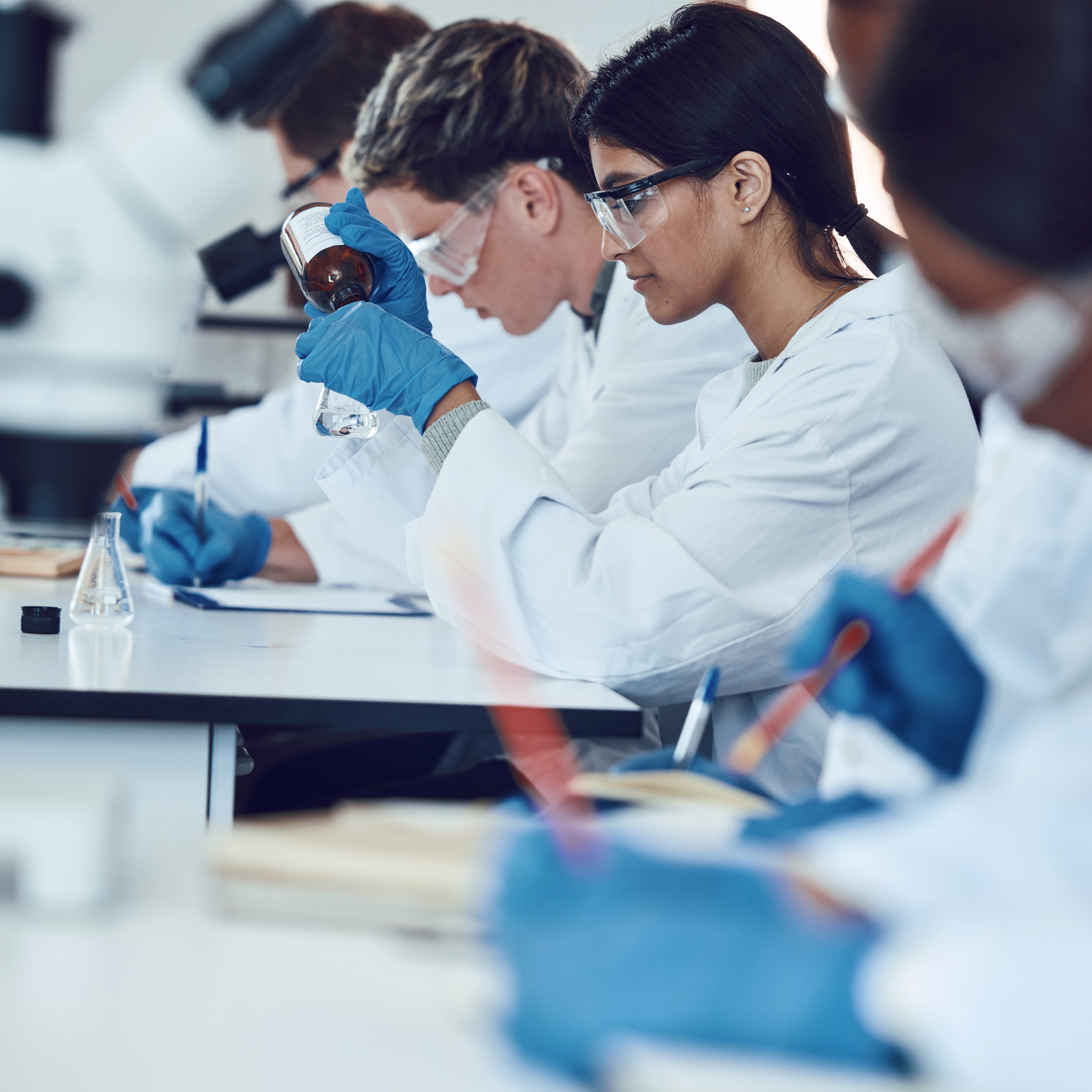 Science, education with students in lab for experiment, learning to be scientist and university with innovation. Teaching, learn and focus with scholarship, research and study for scientific phd.