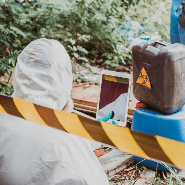 Asian scientist wear Chemical protection suit check danger chemical