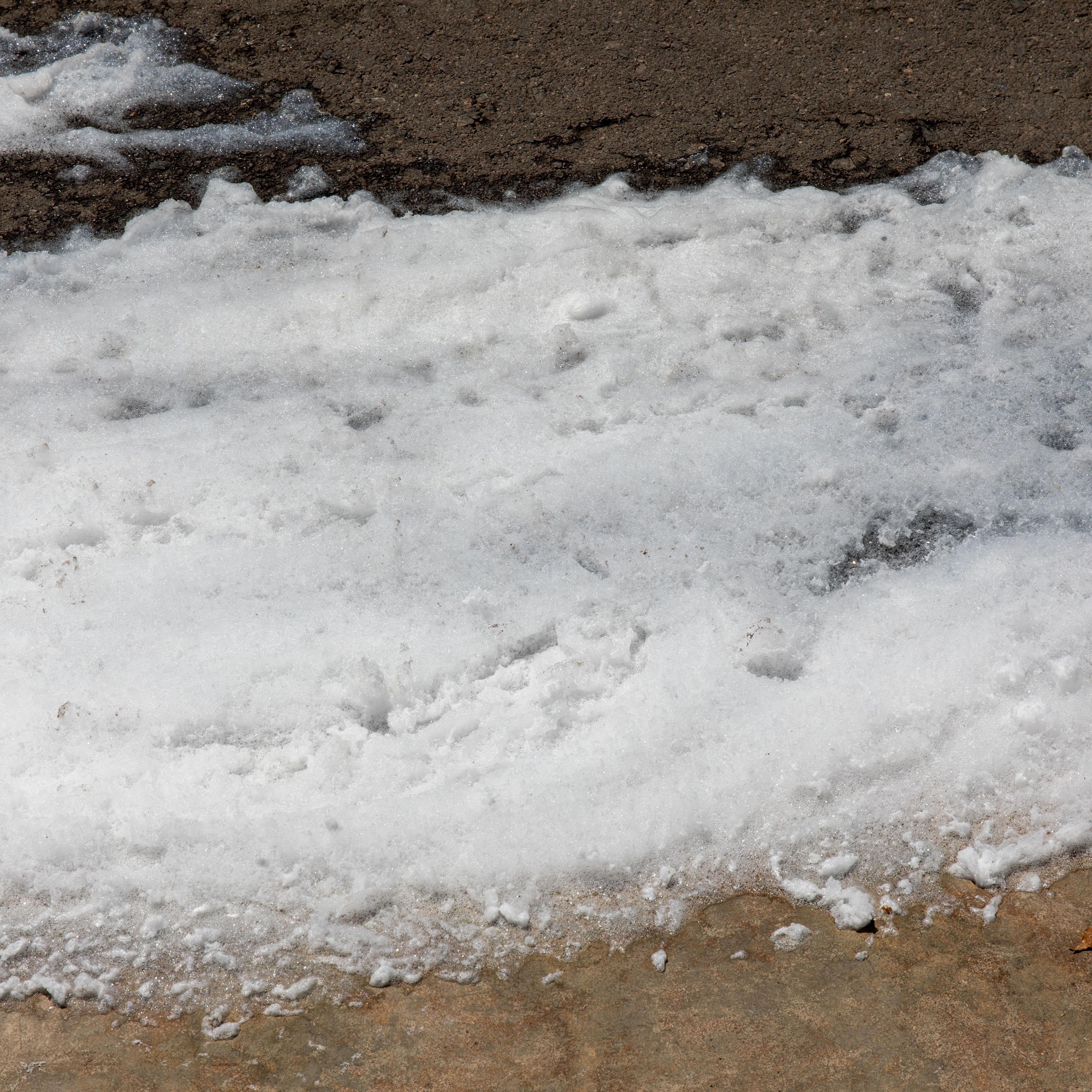 Environmental Hazard: Toxic PFOS Firefighting Foam Spill on Urban Street
