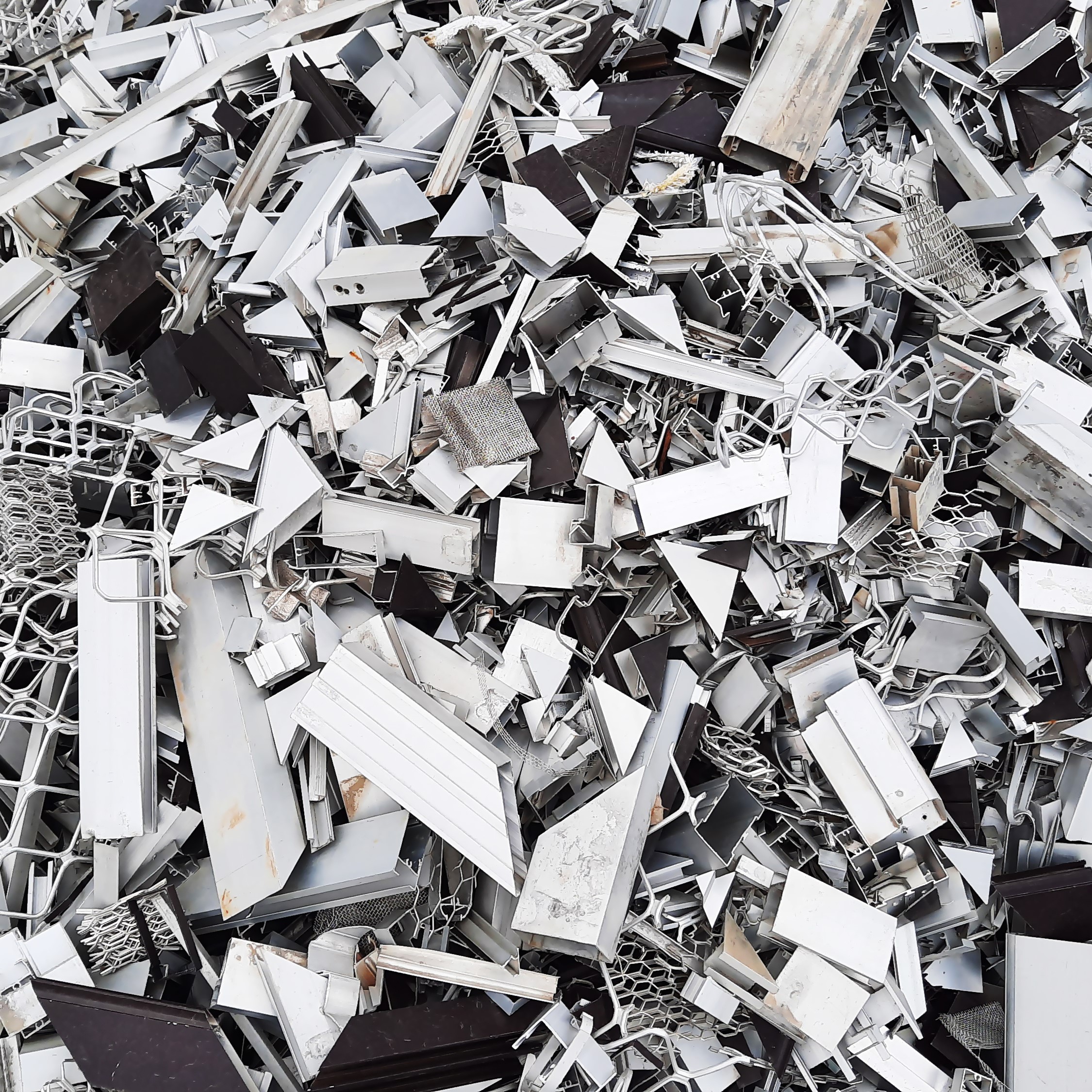 Pile of aluminium frames residue in a furniture workshop for recycling