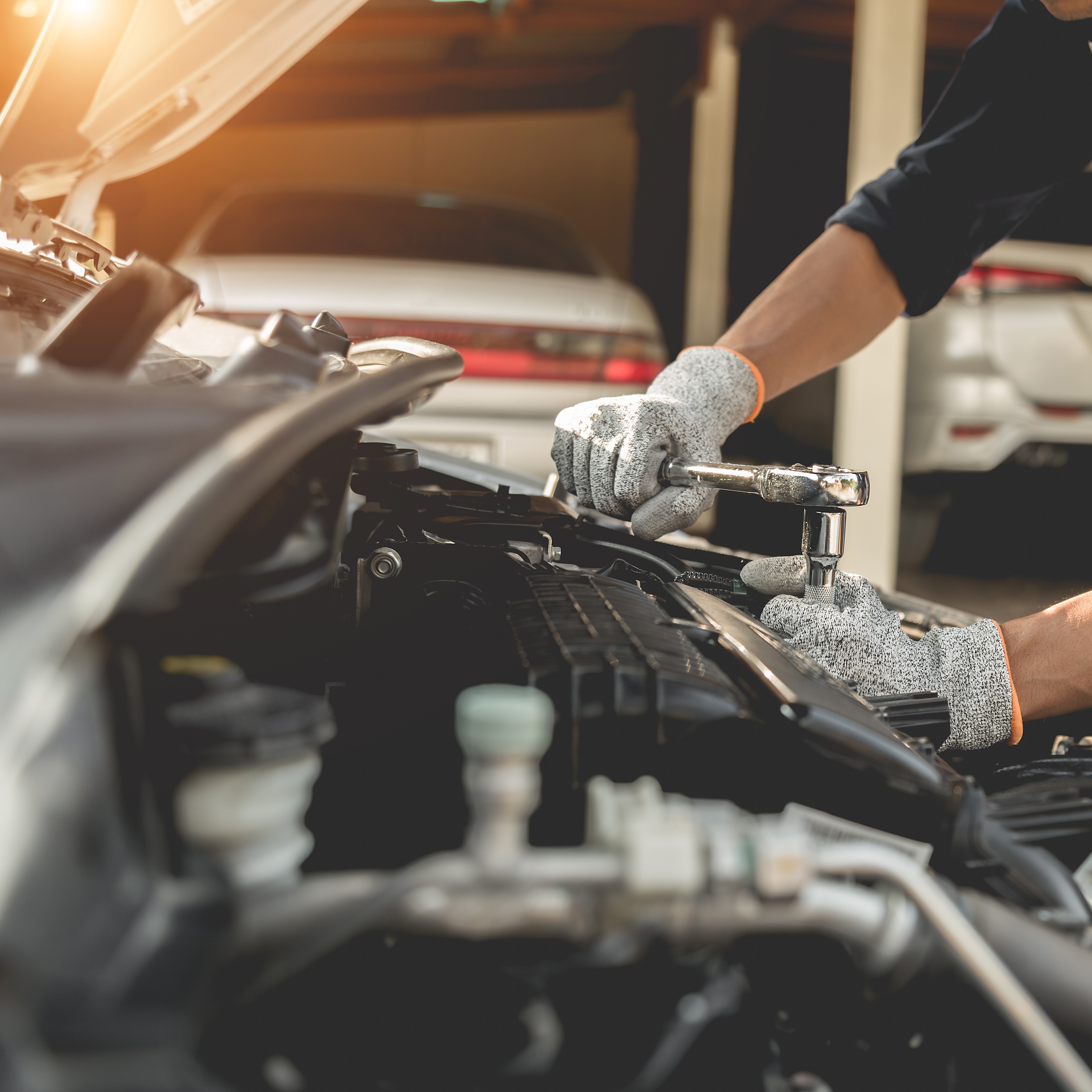 Automobile mechanic repairman hands repairing a car engine automotive workshop with a wrench, car service and maintenance,Repair service.