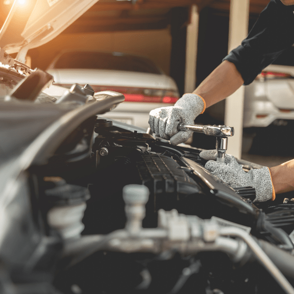 Automobile mechanic repairman hands repairing a car engine automotive workshop with a wrench, car service and maintenance,Repair service.