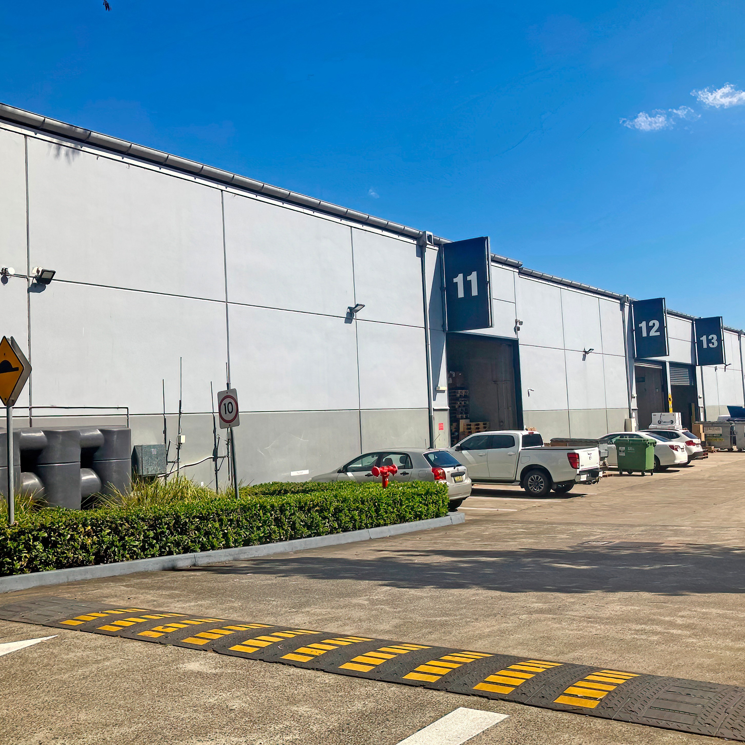 Sydney, NSW Australia - September 2 2023: A driveway to a number of business industrial units in a business park